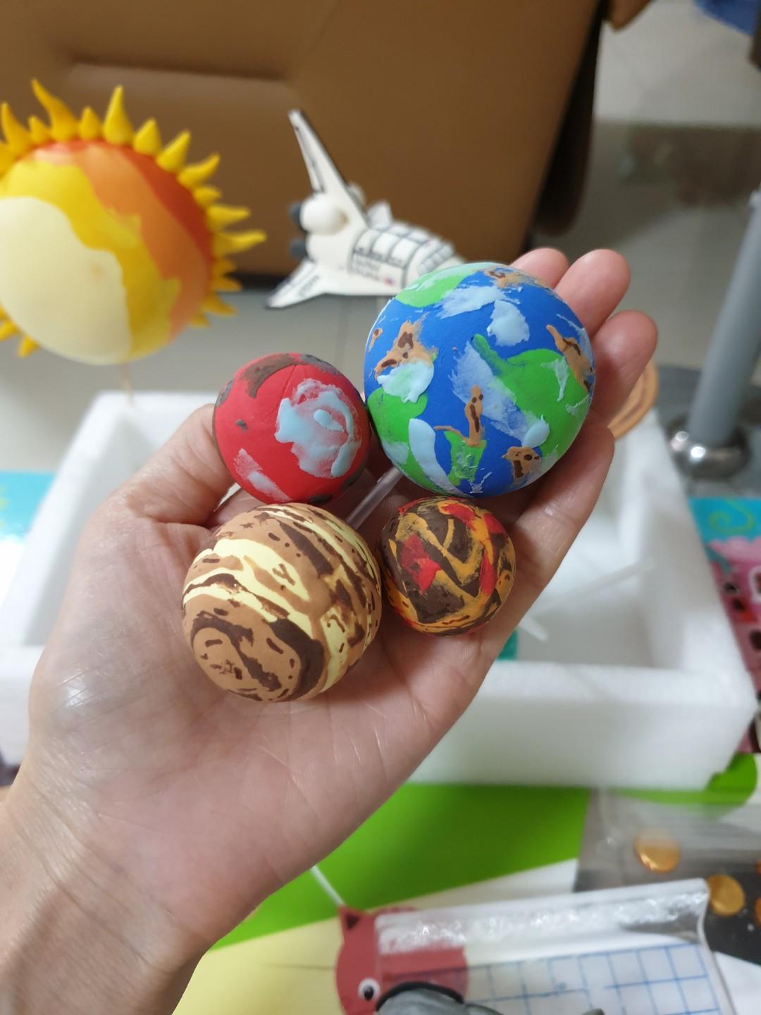 Solar system cake toppers made of air dry clay, Design & Craft