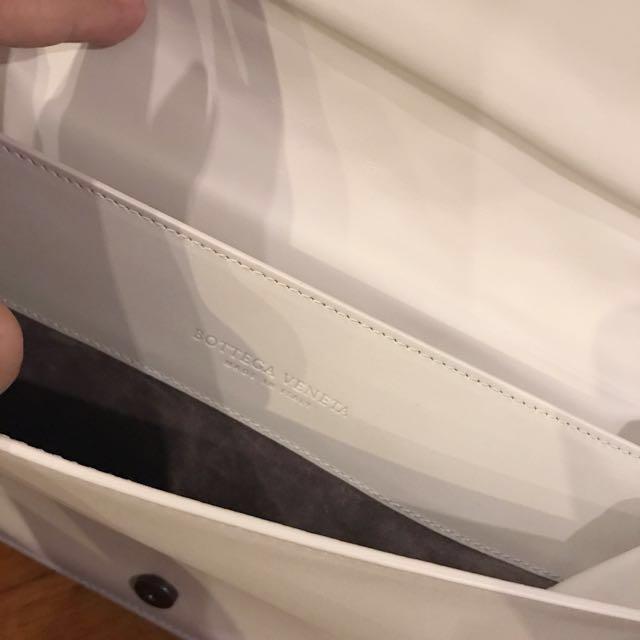 BOTTEGA VENETA Medium Woven White Clutch (Category: Luxury Bags & Wallets) located in Manila. Submitted by bagstagram (Listing ID 130187169, Image 3). Description: Bottega Veneta Montebello Intrecciato Woven Clutch Bag Color: white with hint of gray border Comes with BV dust bag, card and paper bag Height - 17 cm Width - 15 cm Depth- 4-5 cm.