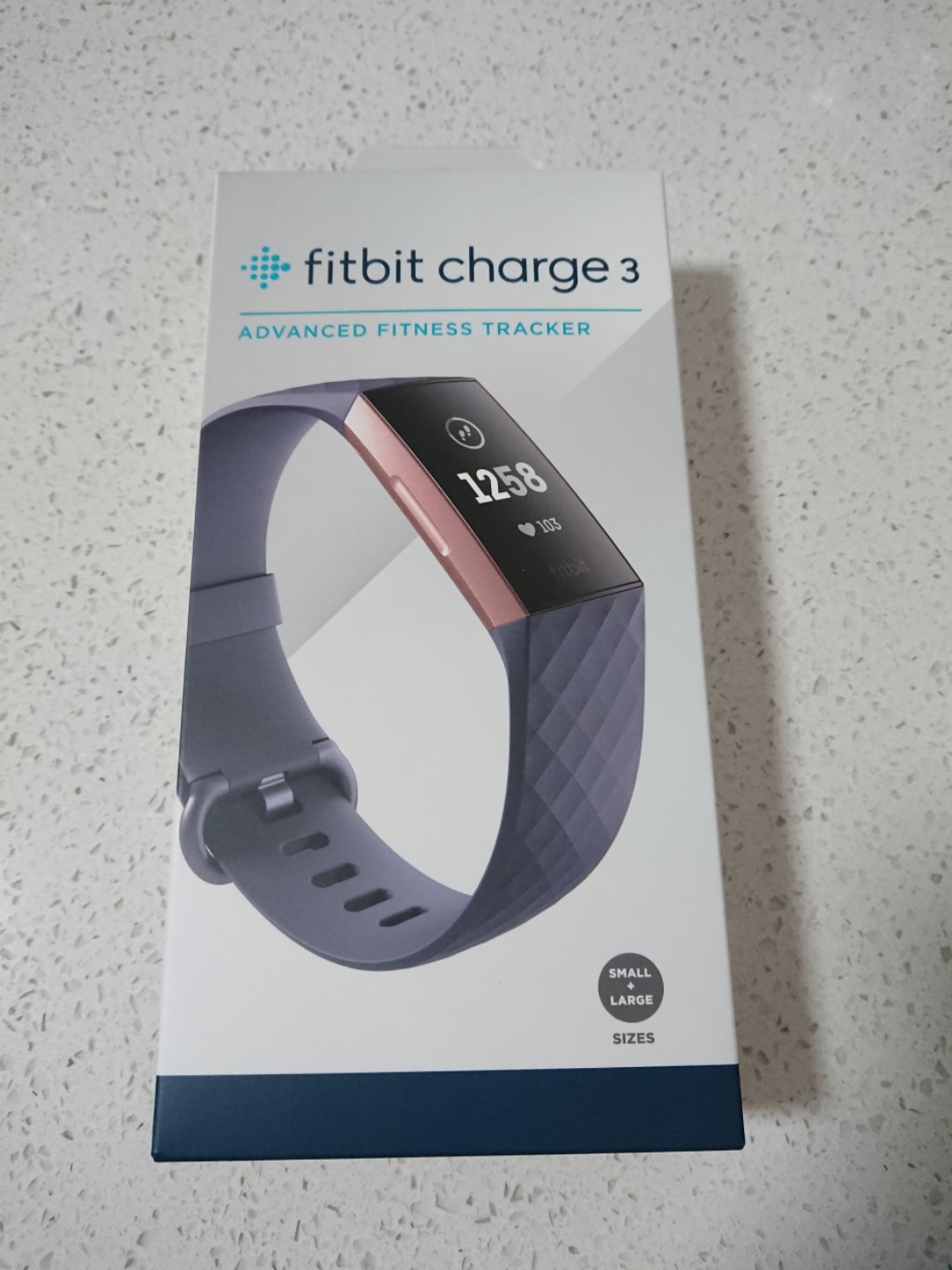 grey and rose gold fitbit charge 3