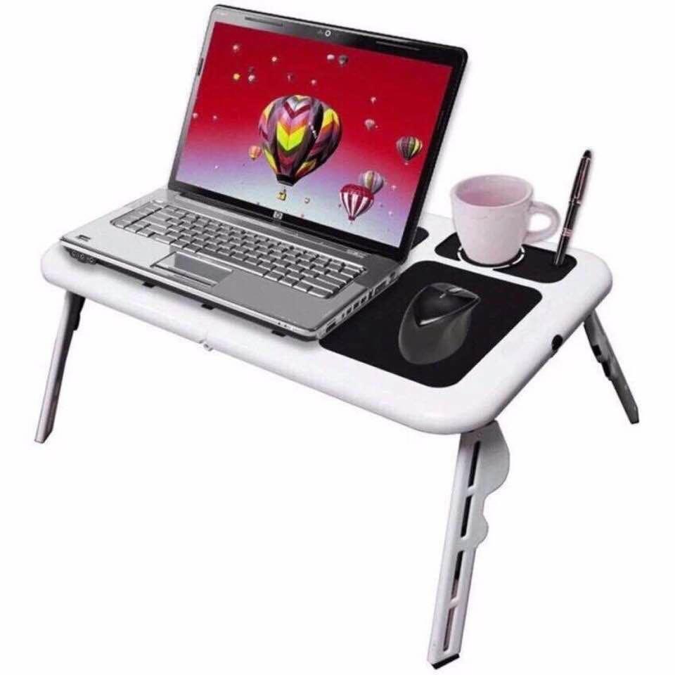 Foldable Laptop with Cooler (Category: Laptops & Notebooks) located in Taguig. Submitted by closetcompany (Listing ID 217635482, Image 1). Description: #freeshippingshopee #cod sc * Fits for any kind of notebook or laptop * Made of Plastic * Can easily folded to minimize space * 2 x USB Cooling Fan * Drinks and Pen Holder * Angled Adjustable Table * With Mouse Pad * Adjustable Legs * Product Size : 560 x 360 x 310 mm * Foldable Size : 285 x 316 x