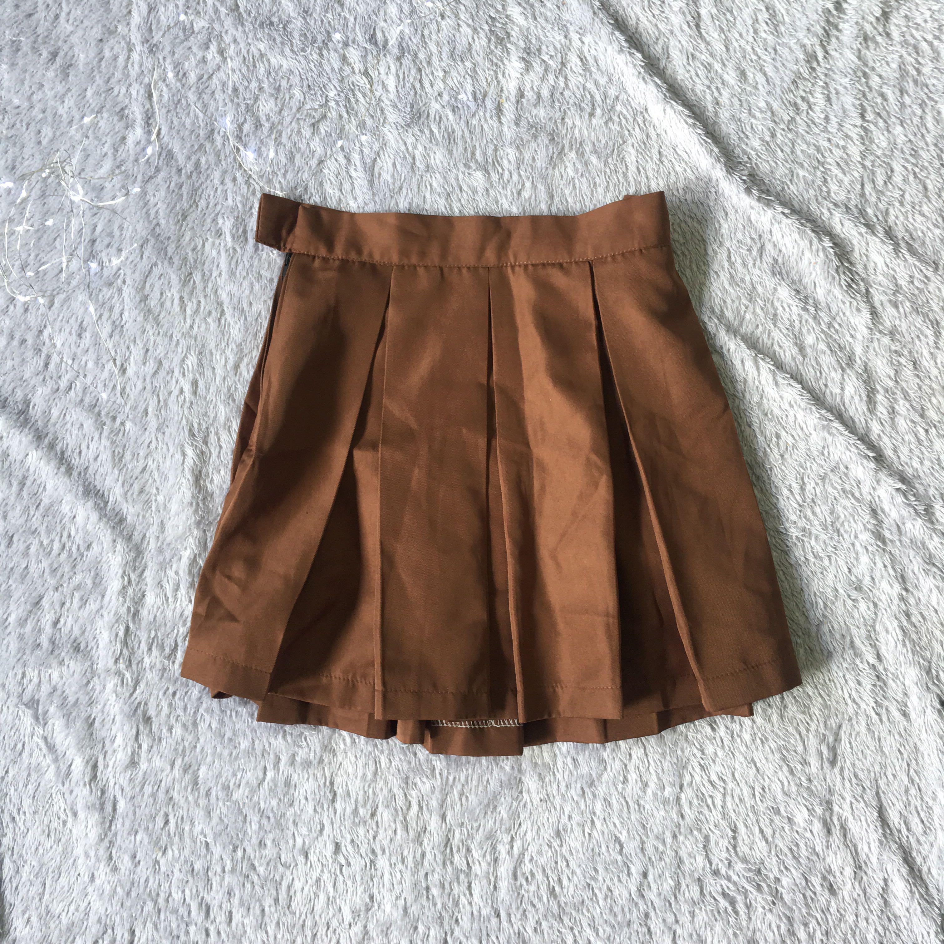 Brown satin plaid pleated skirt (Category: Skirts) located in Manila. Submitted by maaawnicaaa (Listing ID 217476397, Image 1). Description: .