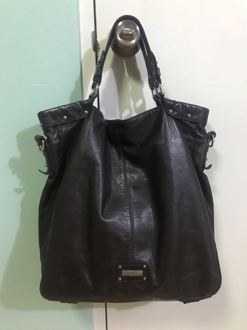 Fino hand / shoulder bag (Category: Shoulder Bags) located in Mandaluyong City. Submitted by beautybuysmnl (Listing ID 218273379, Image 2). Description: Repriced from 6k to 4.5k. Fino two-way bag in chocolate brown leather and silver hardware. With a bag strap. Genuine leather, soft and buttery. Comes with original Fino dust bag. Excellent used condition. .