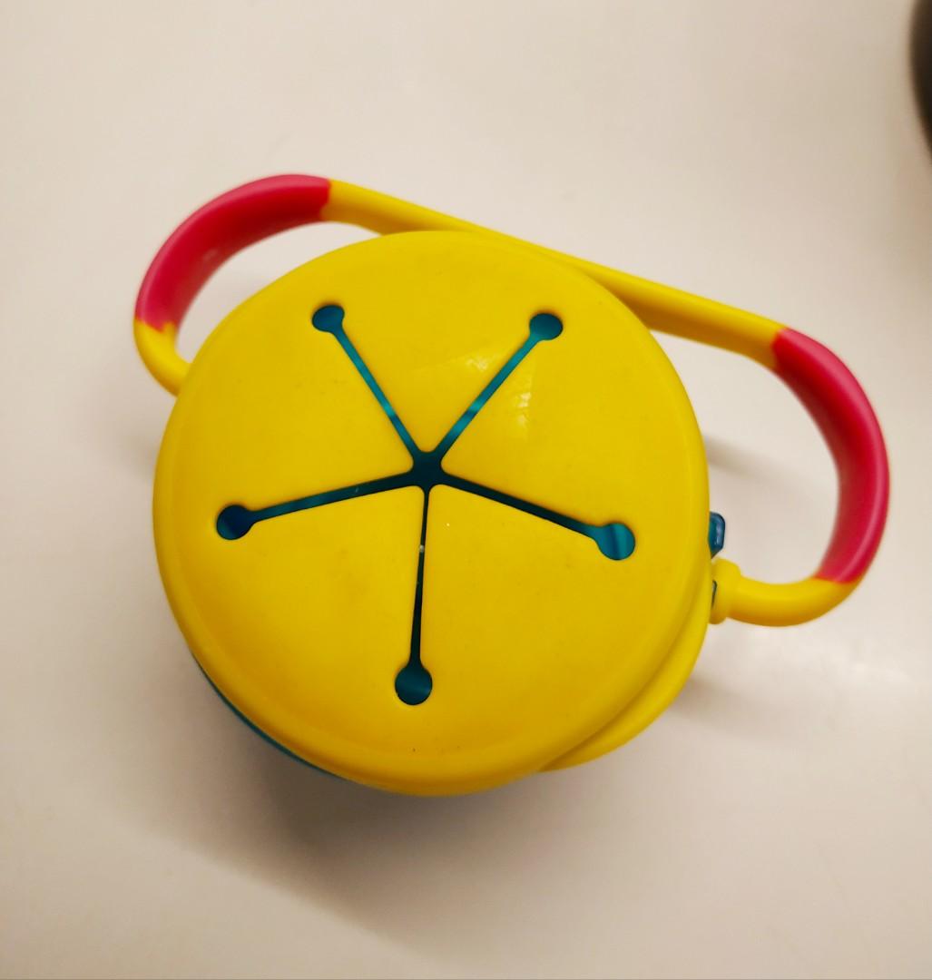 Fisher Price Tote Along Snack Cup (Category: Weaning & Toddler Feeding) located in Manila. Submitted by greatbabystuff (Listing ID 218690757, Image 2). Description: The Tote Along Snacker is the only Snacker that has a carrying handle for use on the go. Little ones will love carrying around the snacker and Mom can hang it on the stroller too. The flexible flap allows little hands to reach into the top but the flap design prevents spills and messe