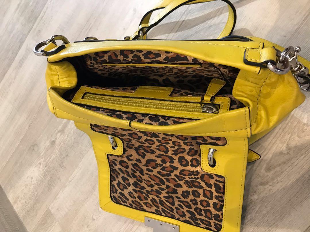 Karen Millen women s yellow mini Satchel with enamel turnlock lemon yellow sling bag with chain