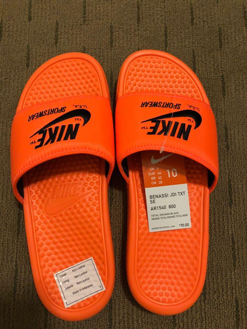 nike slippers black and orange