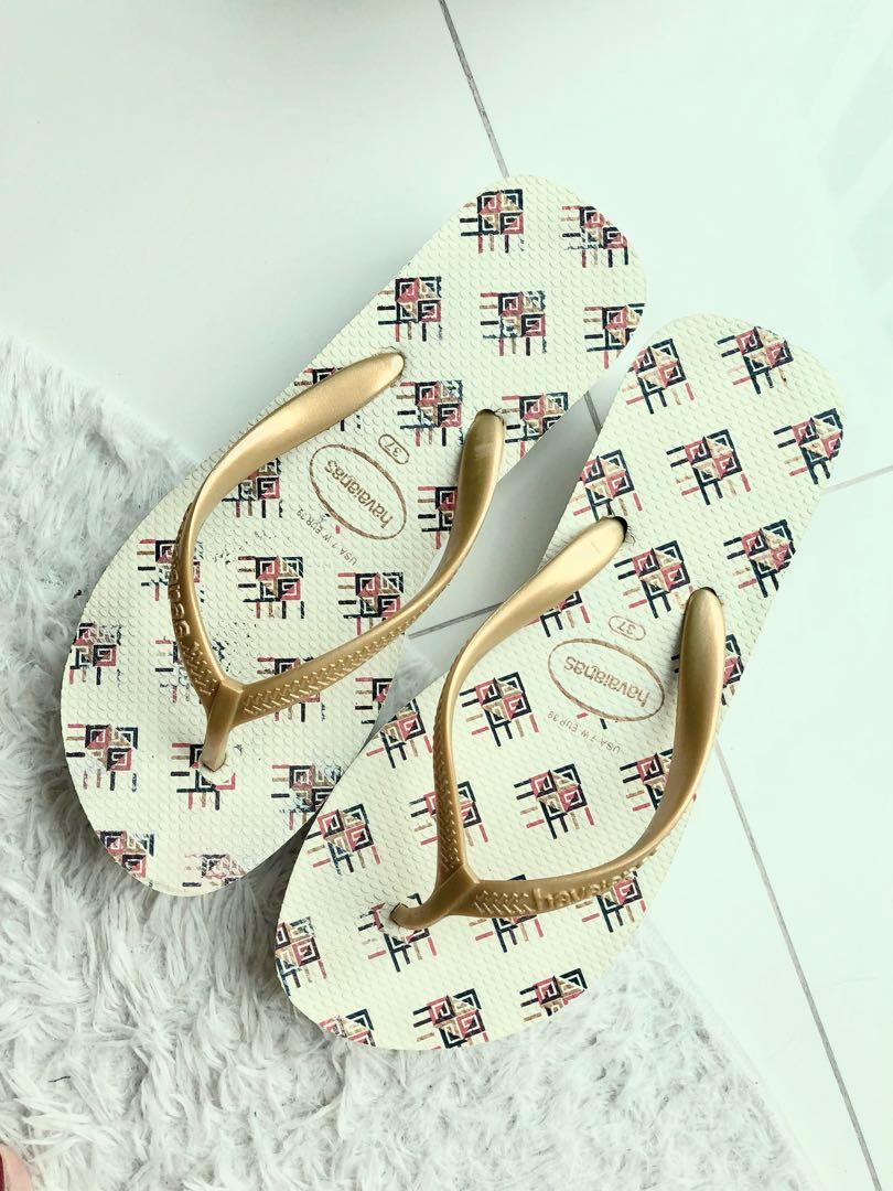 Gold strap flip flops store
