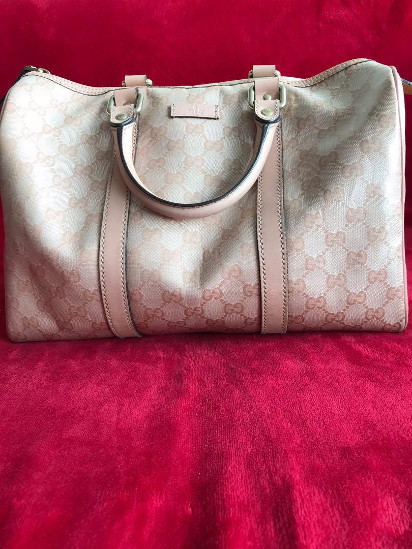Gucci Handbag (Category: Luxury) located in Auckland. Submitted by lilbluestar (Listing ID 219527347, Image 1). Description: Few years old GUCCI hand bag. Some marks underneath the bag as shown in the picture. No strap and no dust bag. Sell as is..;) *Happy bidding and please check on my other listings!.