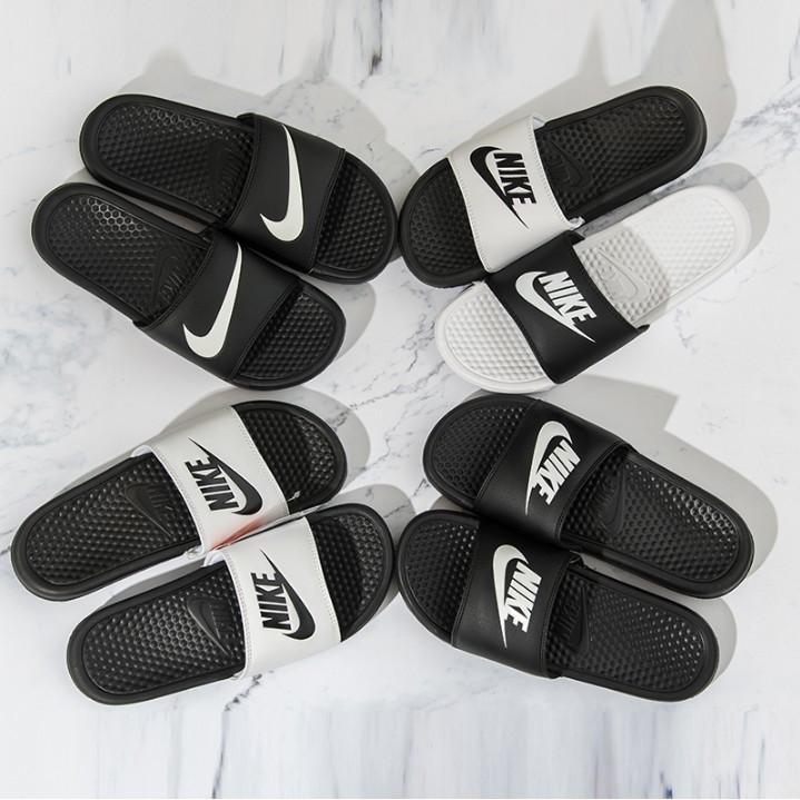 white and black nike slippers