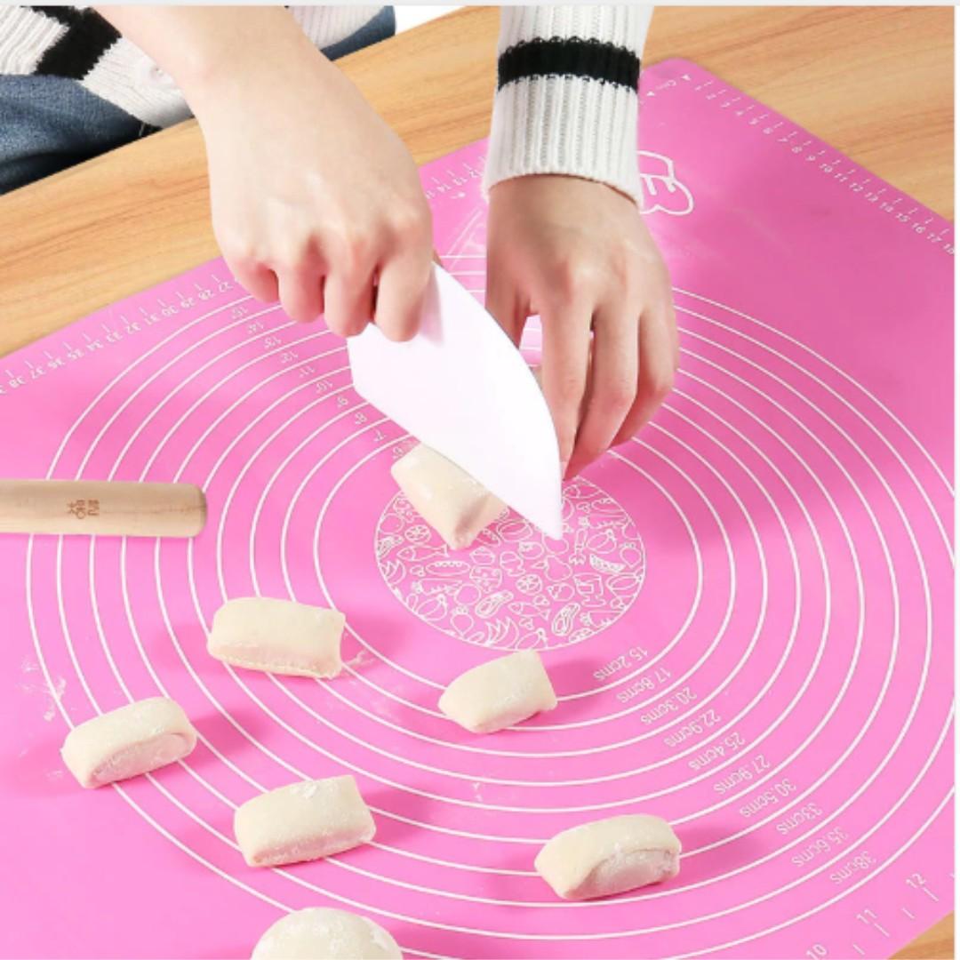 Baking Kneading Mat (Category: Bakeware) located in Manila. Submitted by trustradeglobal (Listing ID 219934208, Image 3). Description: This silicon kneading mat is a must have for all baking enthusiast out ther. It is made from silicone providing a non stick surface, convenient for you to roll dough, pastry and cut apart cakes. Incorporates handy size markings for measuring cakes. It is reusable, non-stick, non-toxic and high temperature resistan
