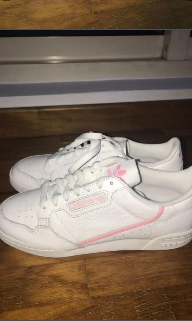 white adidas shoes with pink stripes
