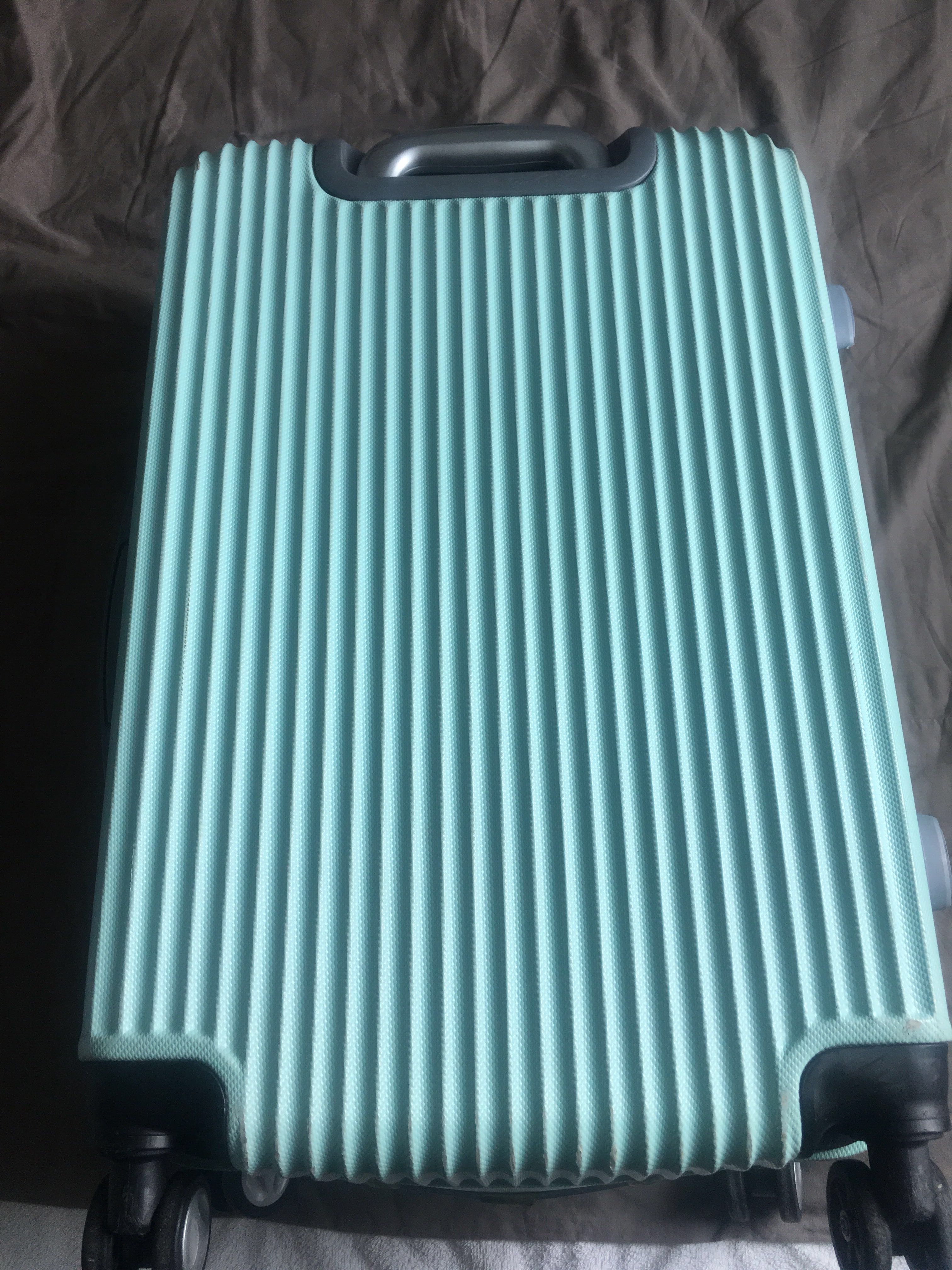 mint green luggage