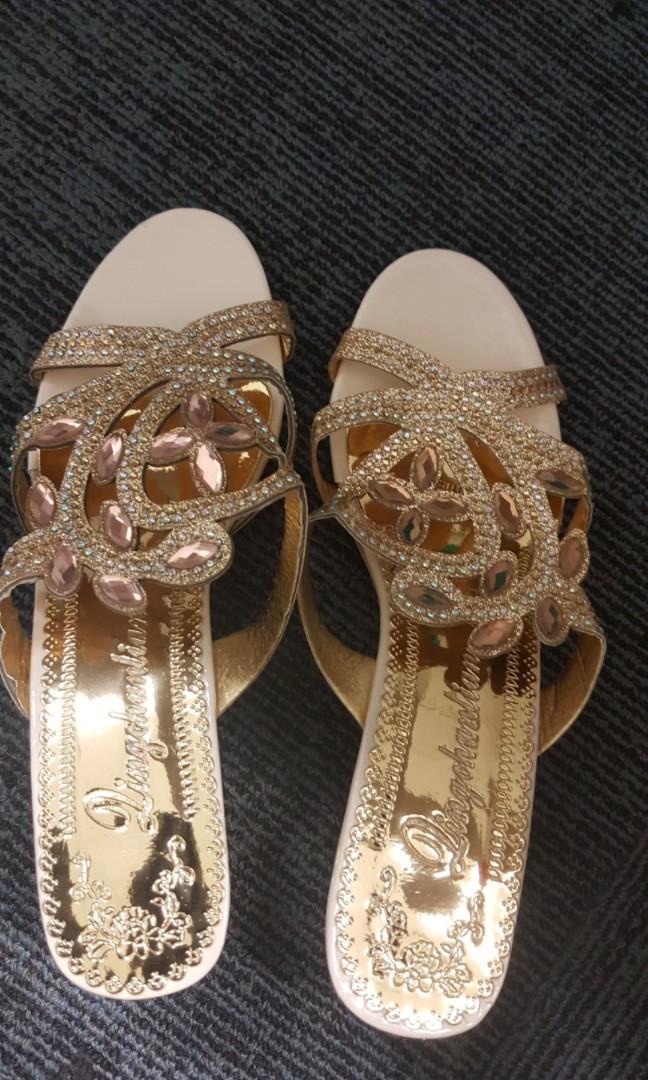 gold colour slippers