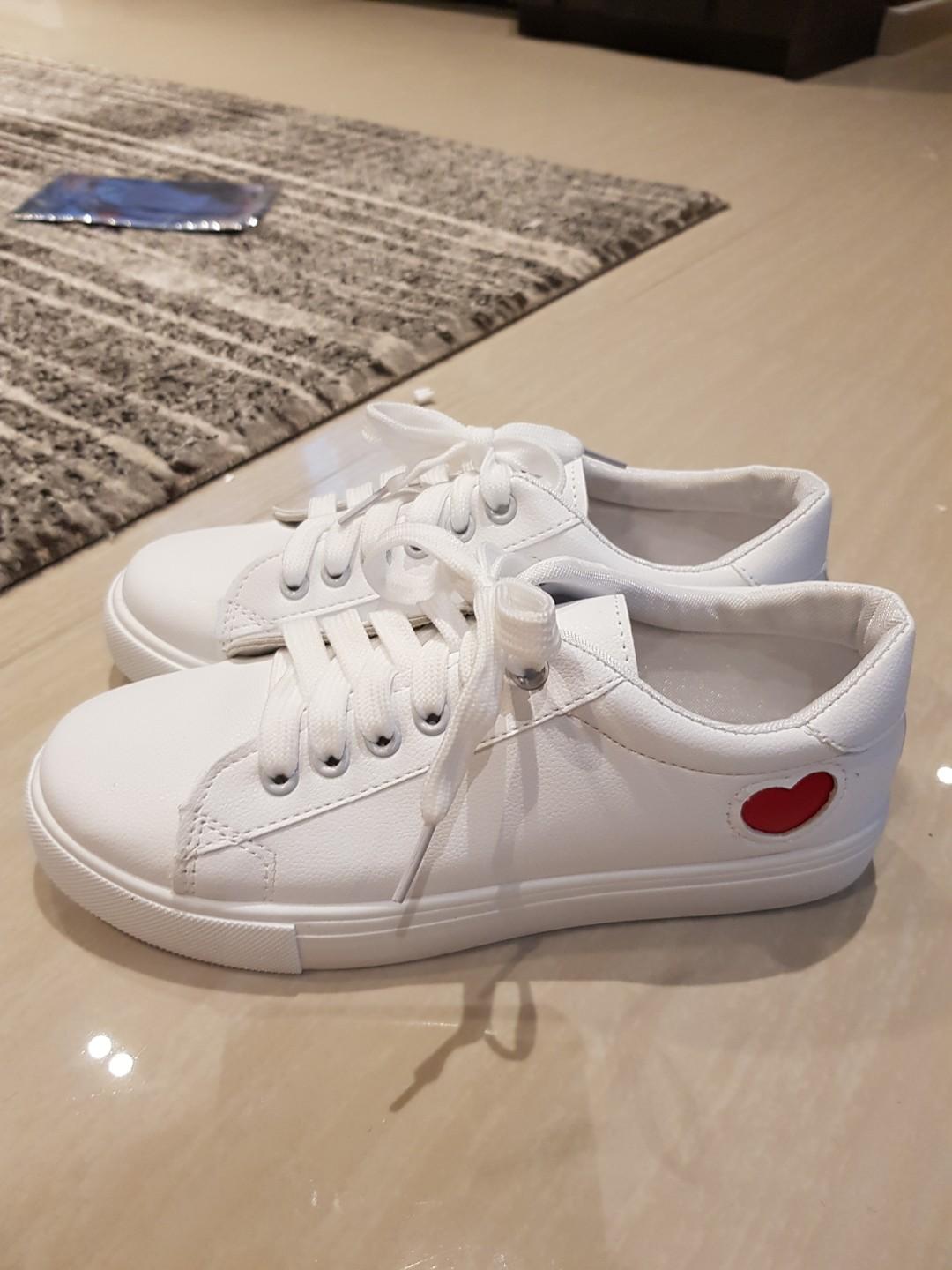 white shoes with red heart