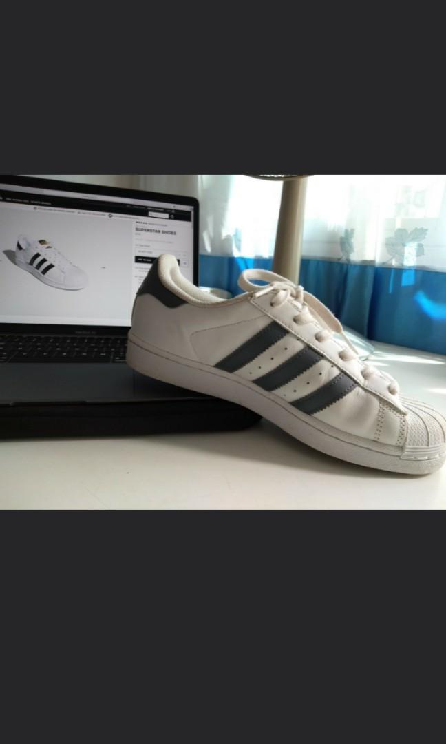 white adidas with grey stripes