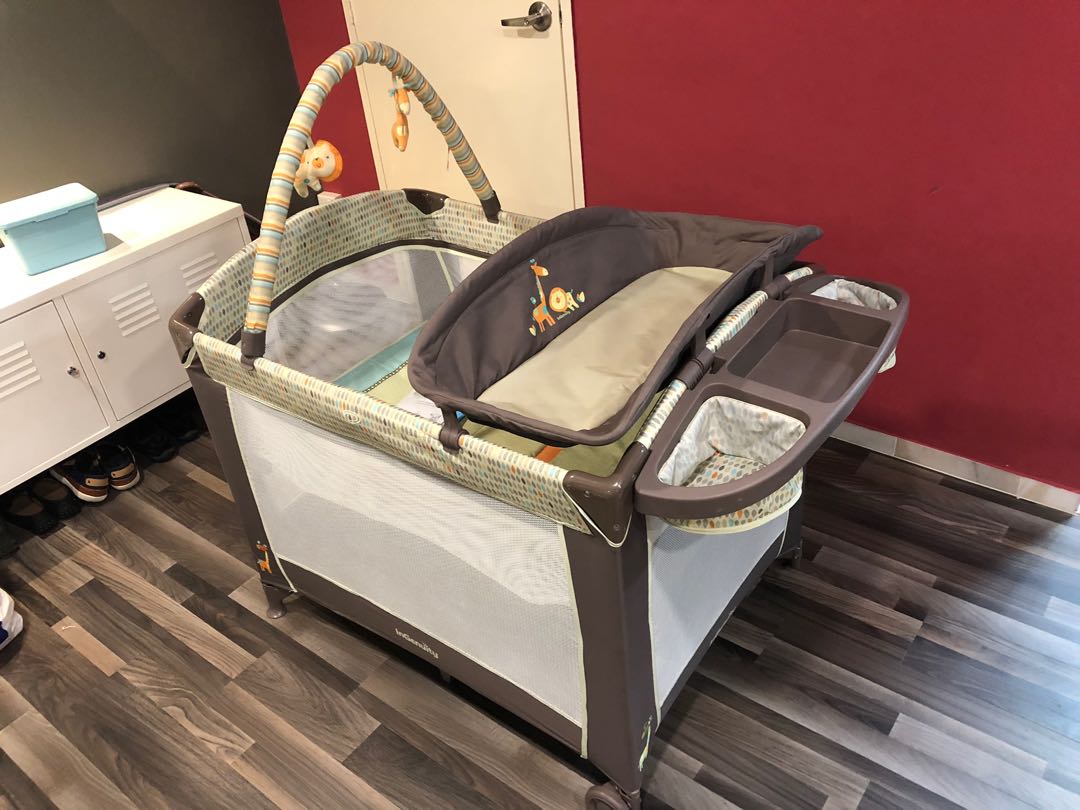 baby cot with changing station