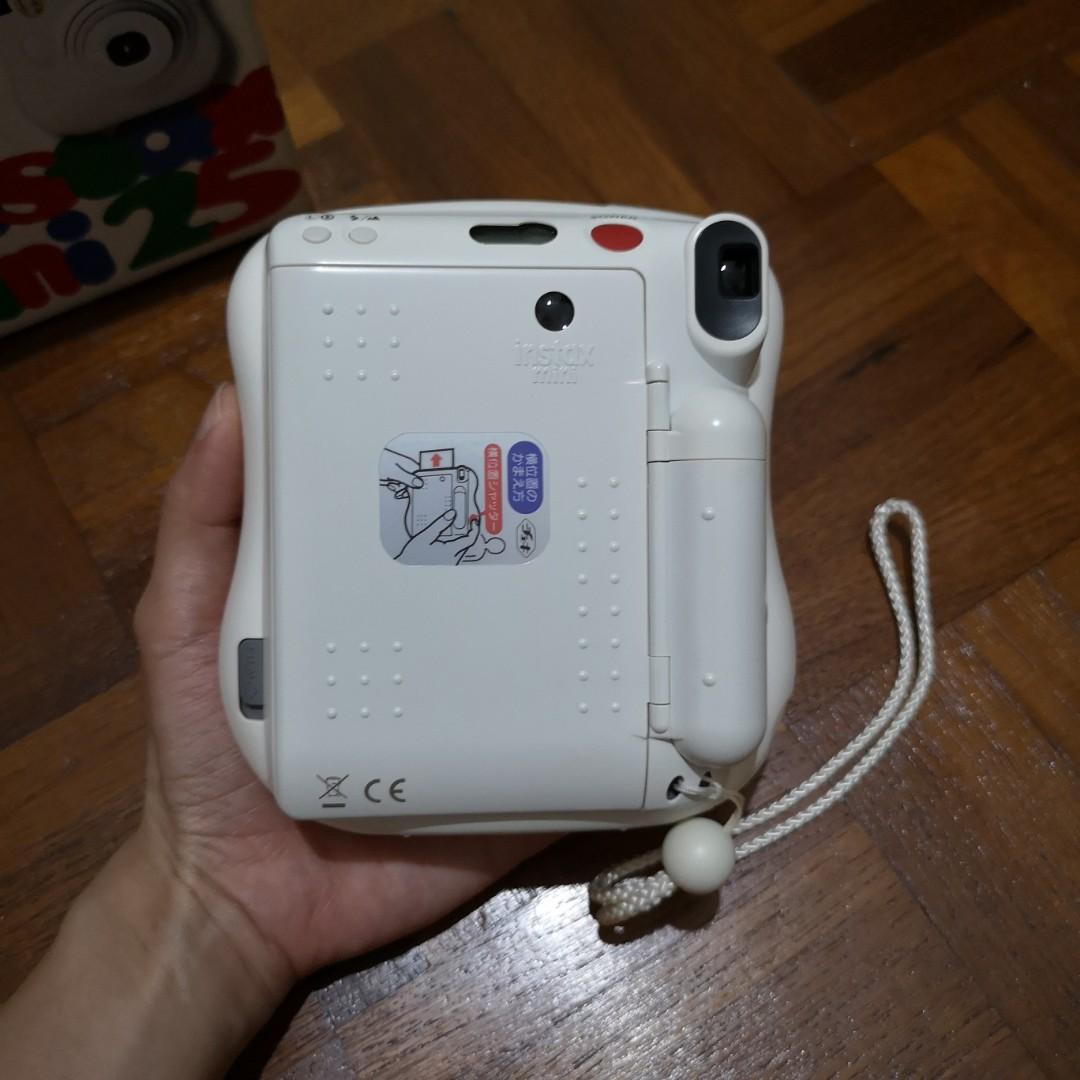 Non-functioning Instax Mini 25 (Category: Cameras) located in Singapore. Submitted by cinnamontree (Listing ID 221583210, Image 2). Description: Non-functioning. in other words, spoilt. only for someone who is able to repair it themselves or find someone else to repair it. problem: I turn it on and the lcd screen is showing '10' and just stuck at that. clicking the shutter buttons doesn't do anything. no flash and no signs of the gears turning to