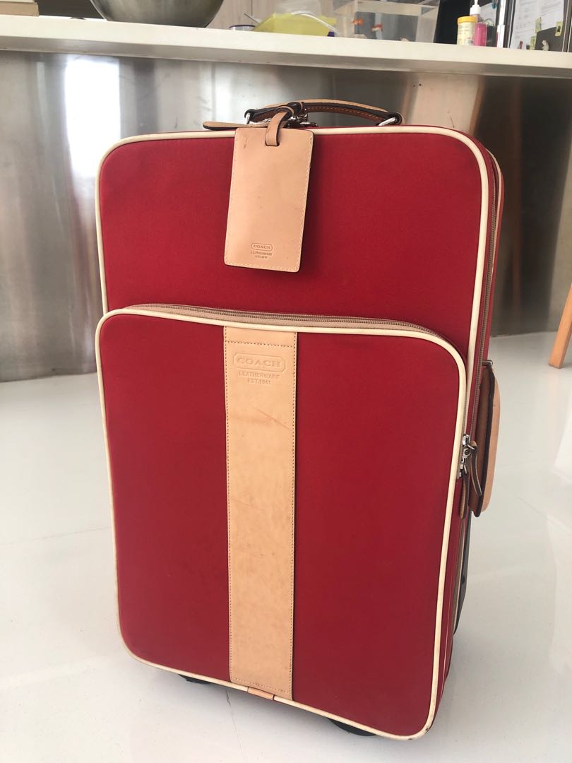 red coach luggage