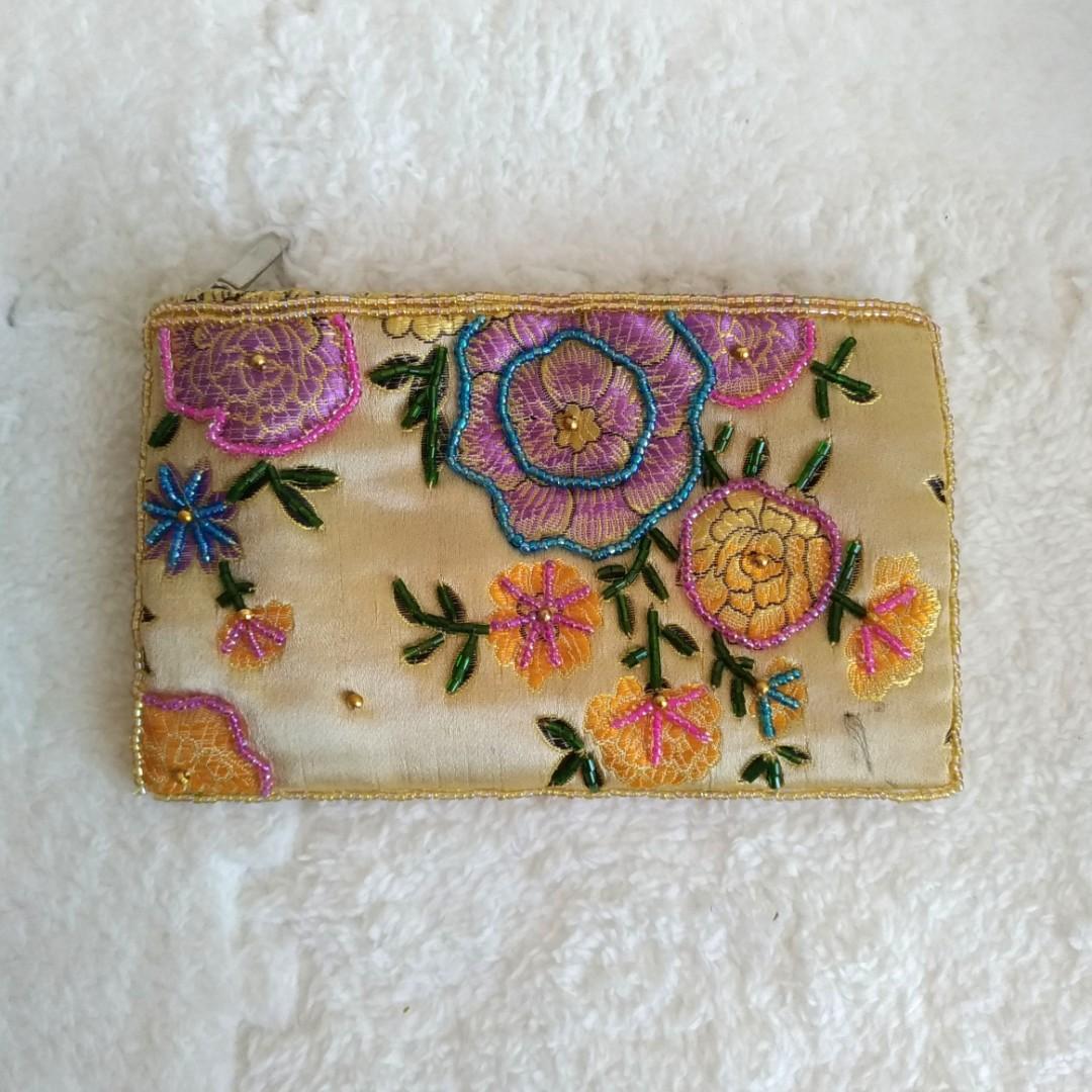 Yellow Gold Embroidered Beaded Small Pouch Wallet (Category: Wallets & Card holders) located in Marikina City. Submitted by trinkets.n.treasures (Listing ID 221797674, Image 1). Description: ✔️ Dimensions: - Height: 9.75 cm - Length: 16 cm - Width: 1.5 cm ✔️ Zipper closure ✔️ Color: Yellow Gold ✔️ Design: Embroidered florals ✔️ has some slight padding, you can use to put makeups in ✔️ Material: Silky fabric PM me if you're interested. 😊💕 #embro