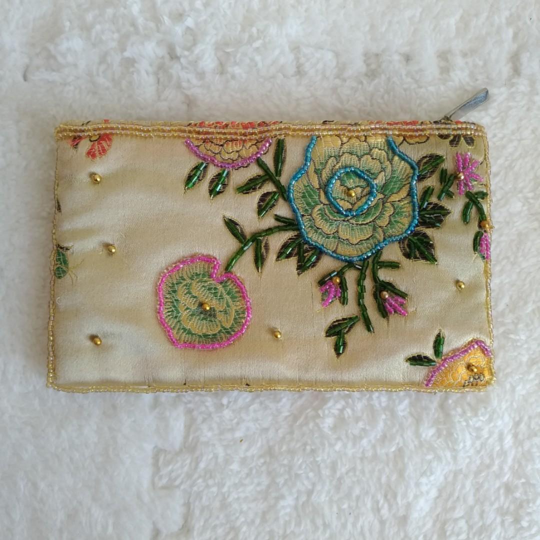 Yellow Gold Embroidered Beaded Small Pouch Wallet (Category: Wallets & Card holders) located in Marikina City. Submitted by trinkets.n.treasures (Listing ID 221797674, Image 2). Description: ✔️ Dimensions: - Height: 9.75 cm - Length: 16 cm - Width: 1.5 cm ✔️ Zipper closure ✔️ Color: Yellow Gold ✔️ Design: Embroidered florals ✔️ has some slight padding, you can use to put makeups in ✔️ Material: Silky fabric PM me if you're interested. 😊💕 #embro
