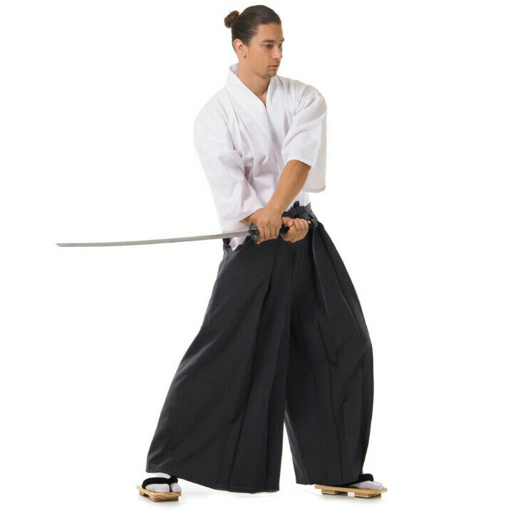 Premium Photo | Aikido master woman in traditional samurai hakama kimono  with black belt with sword katana on white background healthy lifestyle and  sports concept