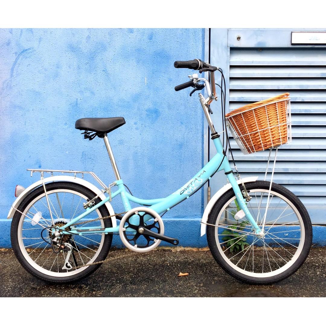 baby blue bike with basket