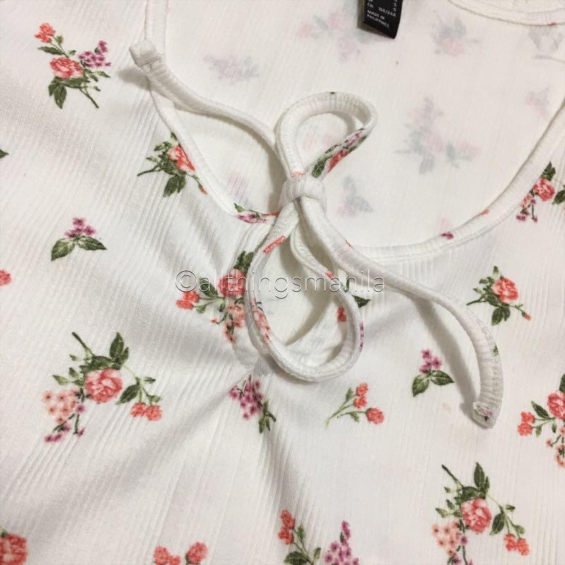 F21 Floral Self Tie Semi Crop Top (Category: Sleeveless) located in Quezon City. Submitted by allthingsmnl (Listing ID 222402429, Image 2). Description: Available in: S and M Brand new - new design ♥️ Super high quality ang fabric. DM me to see when worn photo. Final price posted. For sure buyers only. #aprilsale.