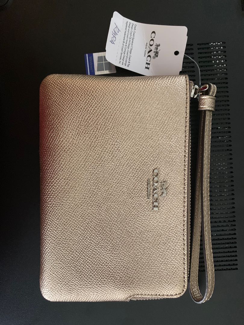 rose gold coach wristlet