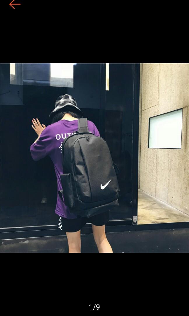 purple and black nike backpack