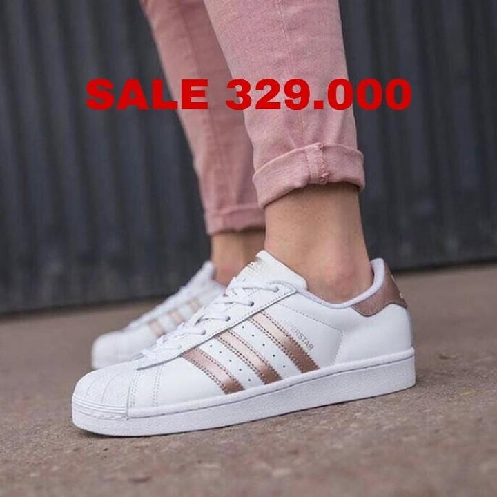 white and peach superstars