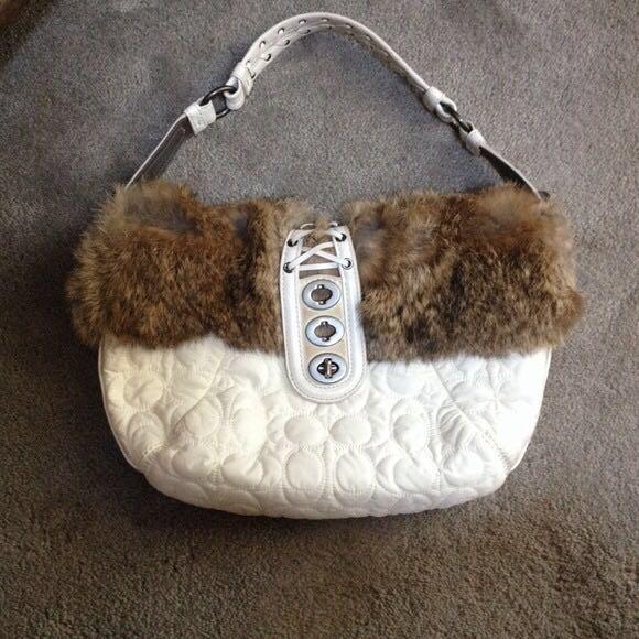 Quilted Coach purse with rabbit fur (Category: Purses & Pouches) located in Manila. Submitted by raincat14 (Listing ID 170487087, Image 1). Description: 💯% Authentic coach purse. Pre-loved ❤️. The small suede accents on closure strap and base of closure strap on back show some dirt. I'm sure it can be cleaned professionally. Satin lining is in pristine shape. (Was $88).