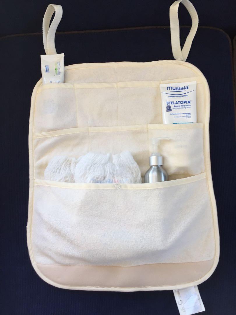 Basic Comfort Hanging Baby Essentials and Diaper Caddy (Category: Bathtub & Bath Accessories) located in Makati City. Submitted by robin_l (Listing ID 223918594, Image 1). Description: In excellent condition. This is a caddy for diapers and baby essentials which can be hung on the side of cribs or changing tables. Has multiple compartments. Padded terry cloth material, fully washable. Has snap buttons for hanging. Please see pictures. (Diapers ab