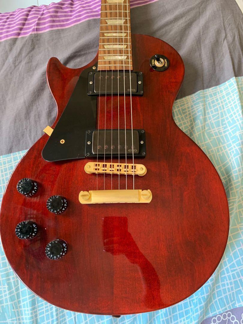 red and gold guitar