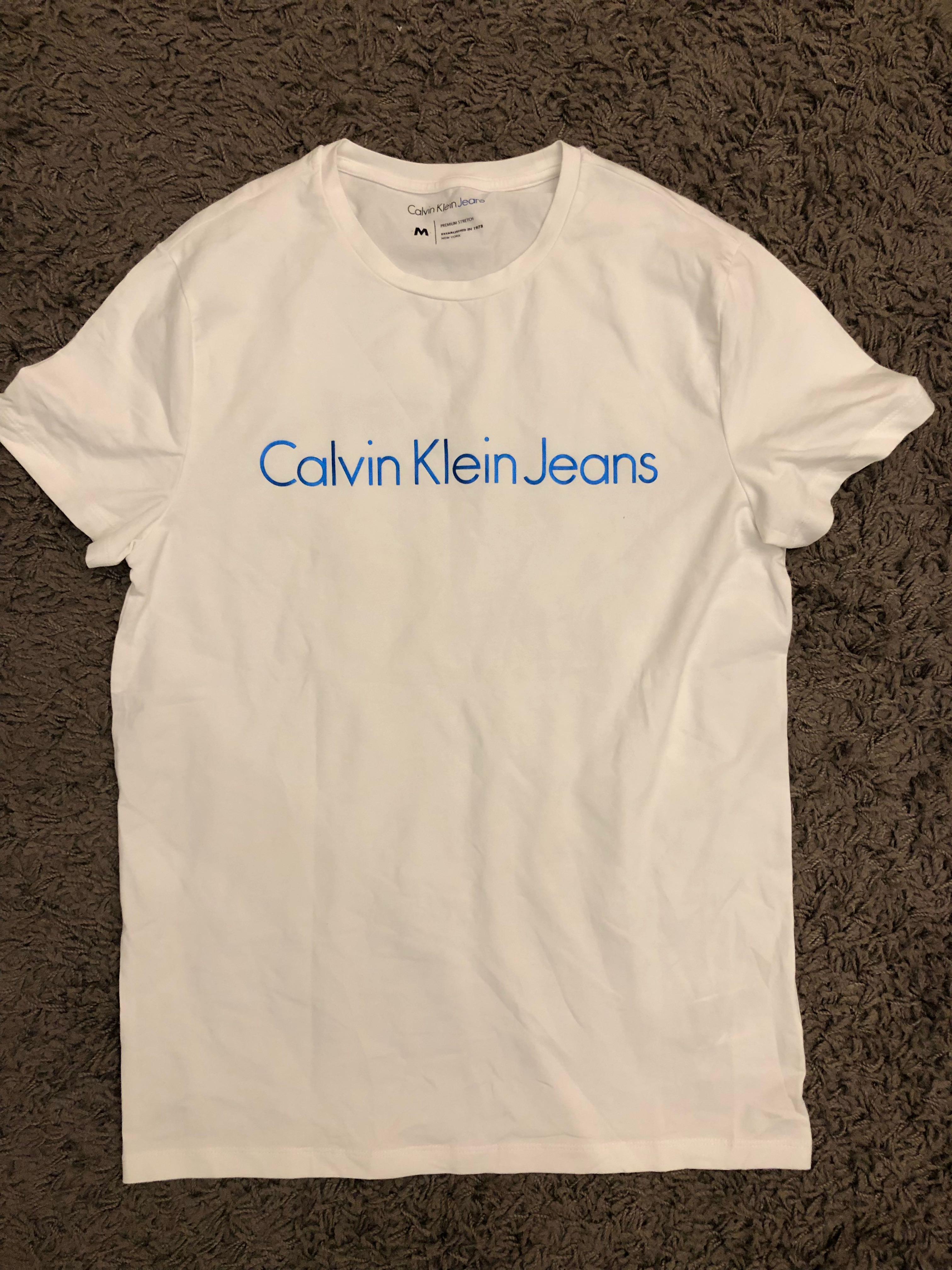 Calvin Klein Jeans White T Shirt For Men, Men'S Fashion, Tops & Sets,  Formal Shirts On Carousell