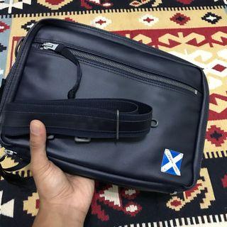LUGGAGE LABEL SLING BAG