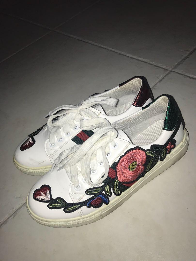 white sneakers with flowers