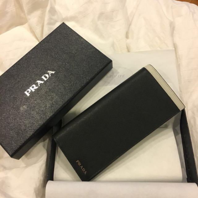 Prada Long Wallet (Category: Wallets & Card Holders) located in Singapore. Submitted by xenerahsx (Listing ID 148216708, Image 1). Description: Received as a gift But not what I would use hence selling With paper bag.