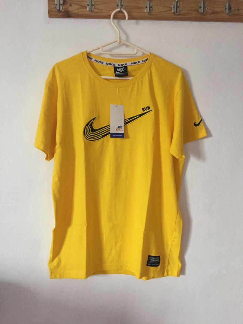 yellow nike tee shirt