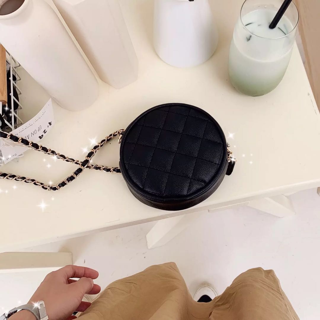 black round sling bag
