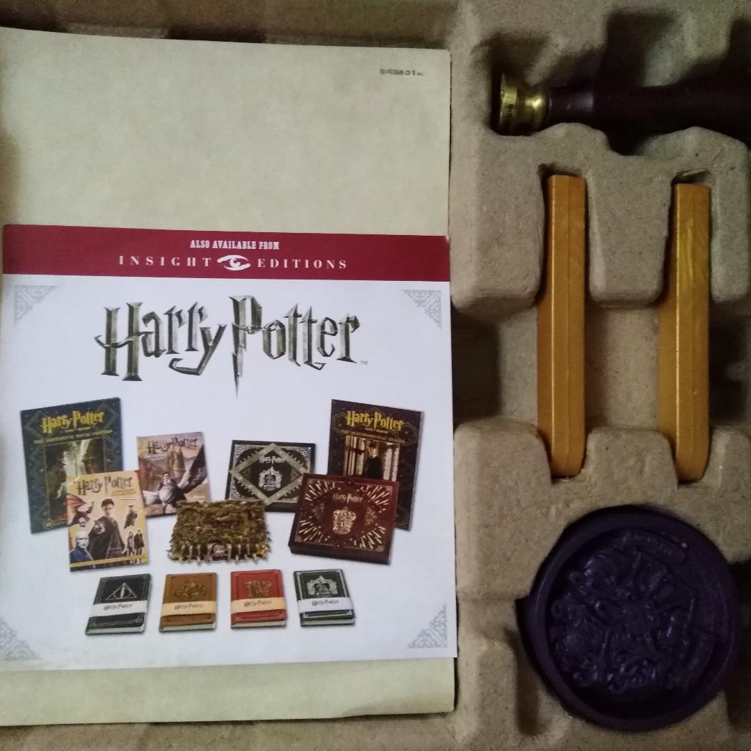 Harry Potter Hogwarts Deluxe Stationery Set (Category: Stationery & School Supplies) located in Marikina City. Submitted by skowshop (Listing ID 225449131, Image 2). Description: Set Includes: Wax stamp & two golden wax sticks Hogwarts Crested letter-writing paper & matching envelopes Purple Hogwarts Crest paperweight NOTE: Journal not included, no longer sealed National Bookstore Price: P1679.00.