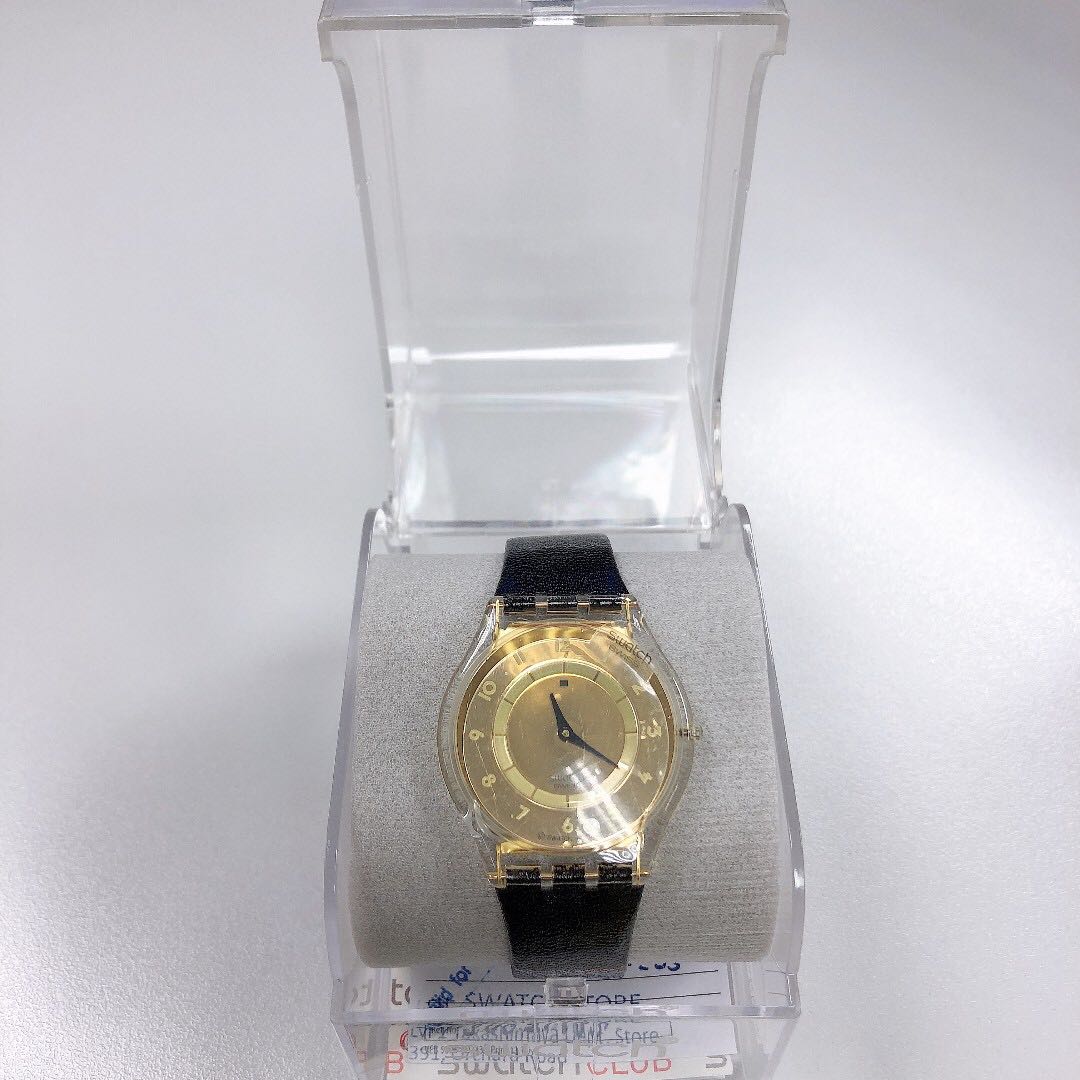 black and gold swatch watch