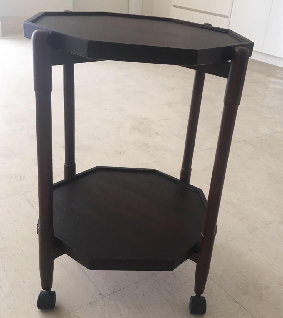 Side table (Category: Tables & Sets) located in Kuala Lumpur. Submitted by ivegotcoolthings (Listing ID 225771810, Image 1). Description: 2 level side-table with wheels , hexagonal table shape ,dark wood in colour , easily dismantled Size : 26” height , 18” diameter. Still in good working condition. Original price was RM124, bought overseas when we were expats. Collection only, please arrange your own transportation. .