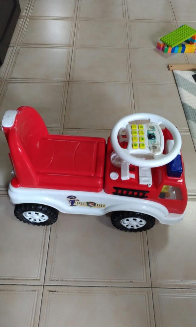 Todder Car (Category: Infant Playtime) located in Singapore. Submitted by joar.keryon (Listing ID 226213619, Image 2). Description: Toddler kick car.. Main siren on truck body still works.. Electronics on steering wheel no longer working...