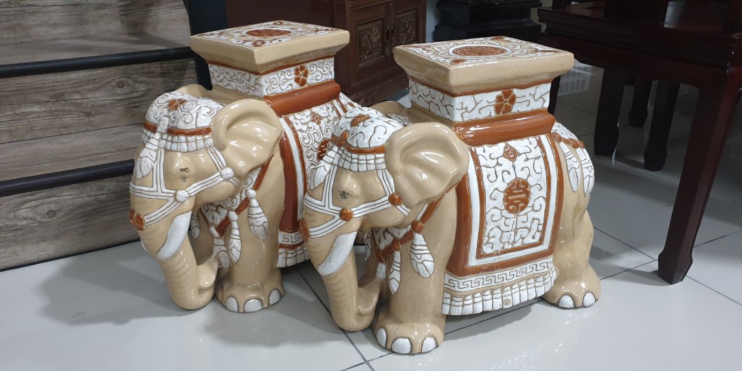 A pair of vintage porcelain elephant stools