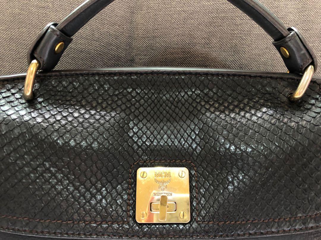 Authentic MCM python skin handbag (Category: Bags & Wallets) located in Singapore. Submitted by paperbunnylover (Listing ID 226396643, Image 2). Description: Authentic and original, comes with dust bag; really great versatile bag that’s easy to match with your outfits and fits a lot for the size; slight signs of wear on the hardware but otherwise in great condition .