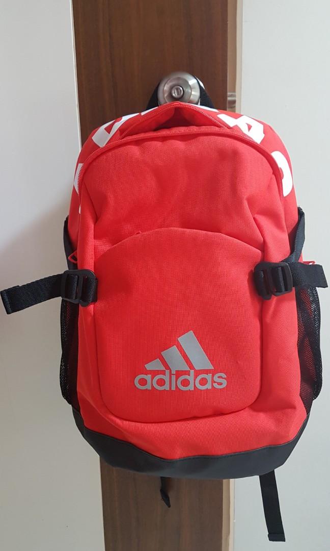 orange and black adidas backpack