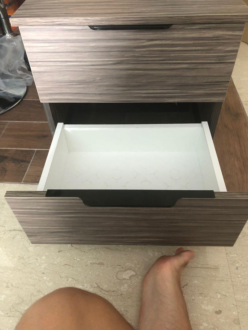 Bedside table (Category: Tables & Sets) located in Singapore. Submitted by goh.keane (Listing ID 226876756, Image 3). Description: Brand new beside drawer. Bought 1 extra. Self pick at Bukit Panjang. Negotiable if fast deal Dimensions: (L) 47cm (H) 44.5cm (W) 34.8cm.