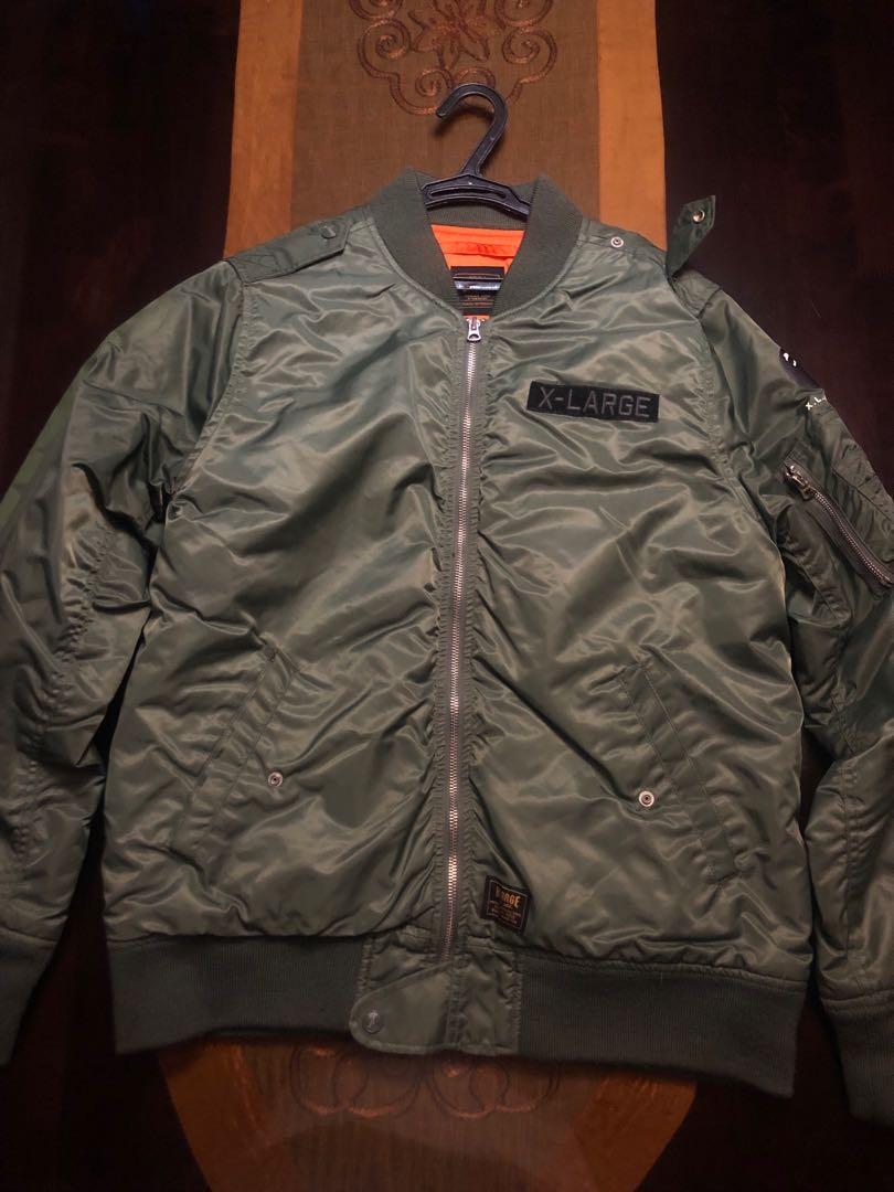 X-Large Olive Bomber Jacket (Category: Hoodies) located in Manila. Submitted by decluttuhhh (Listing ID 226972604, Image 1). Description: X-Large Olive Bomber Jacket Fits L-Xl Superb quality Subtle side sleeve decal With Patch Orange inner 3500php.