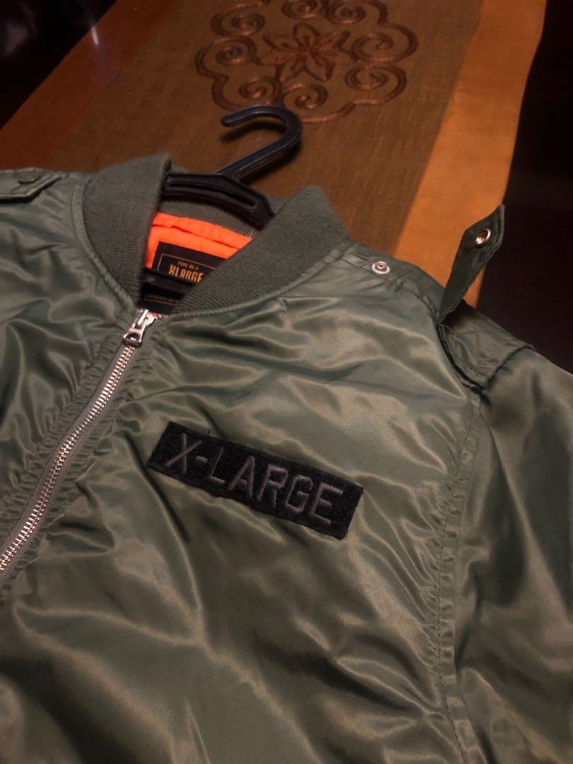 X-Large Olive Bomber Jacket (Category: Hoodies) located in Manila. Submitted by decluttuhhh (Listing ID 226972604, Image 3). Description: X-Large Olive Bomber Jacket Fits L-Xl Superb quality Subtle side sleeve decal With Patch Orange inner 3500php.