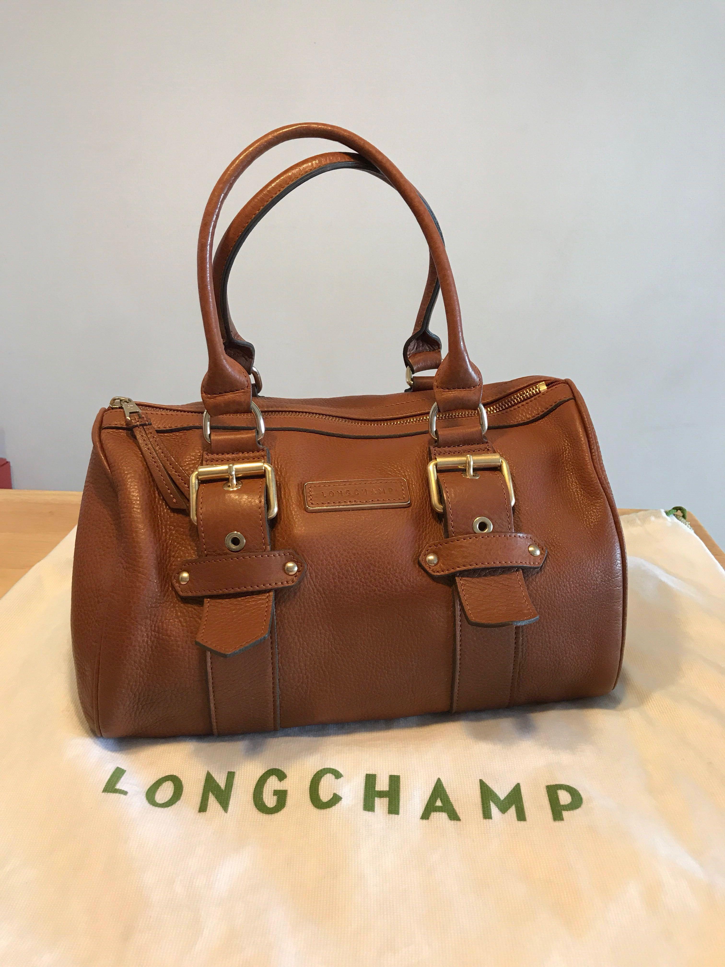 Longchamp Brown Leather Bag (Category: Bags & Wallets) located in Singapore. Submitted by kylie_w (Listing ID 156784358, Image 1). Description: Preloved 100% authentic Condition - 8.5/10 Not for fussy buyers.