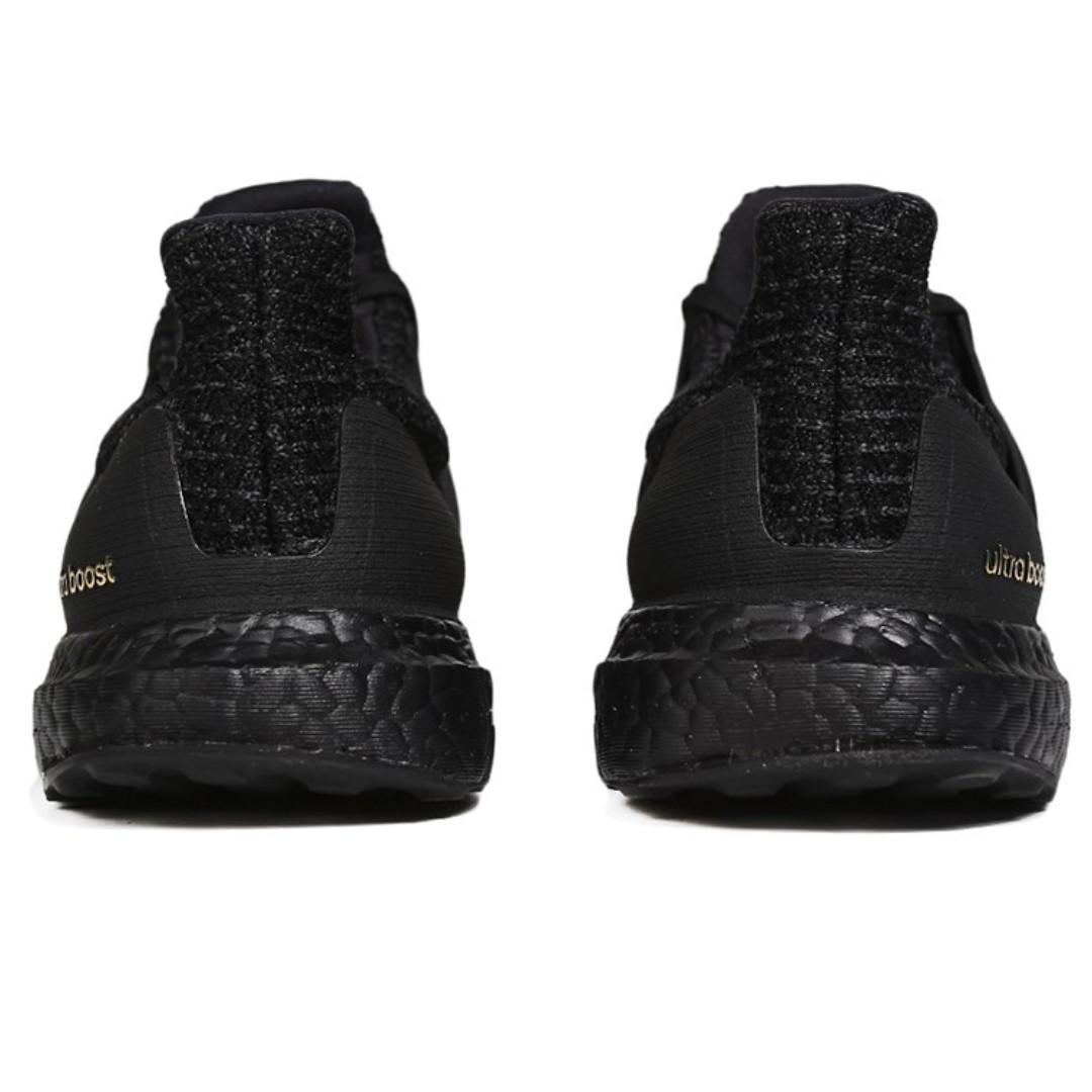 Ultra boost 4.0 triple black gold hotsell